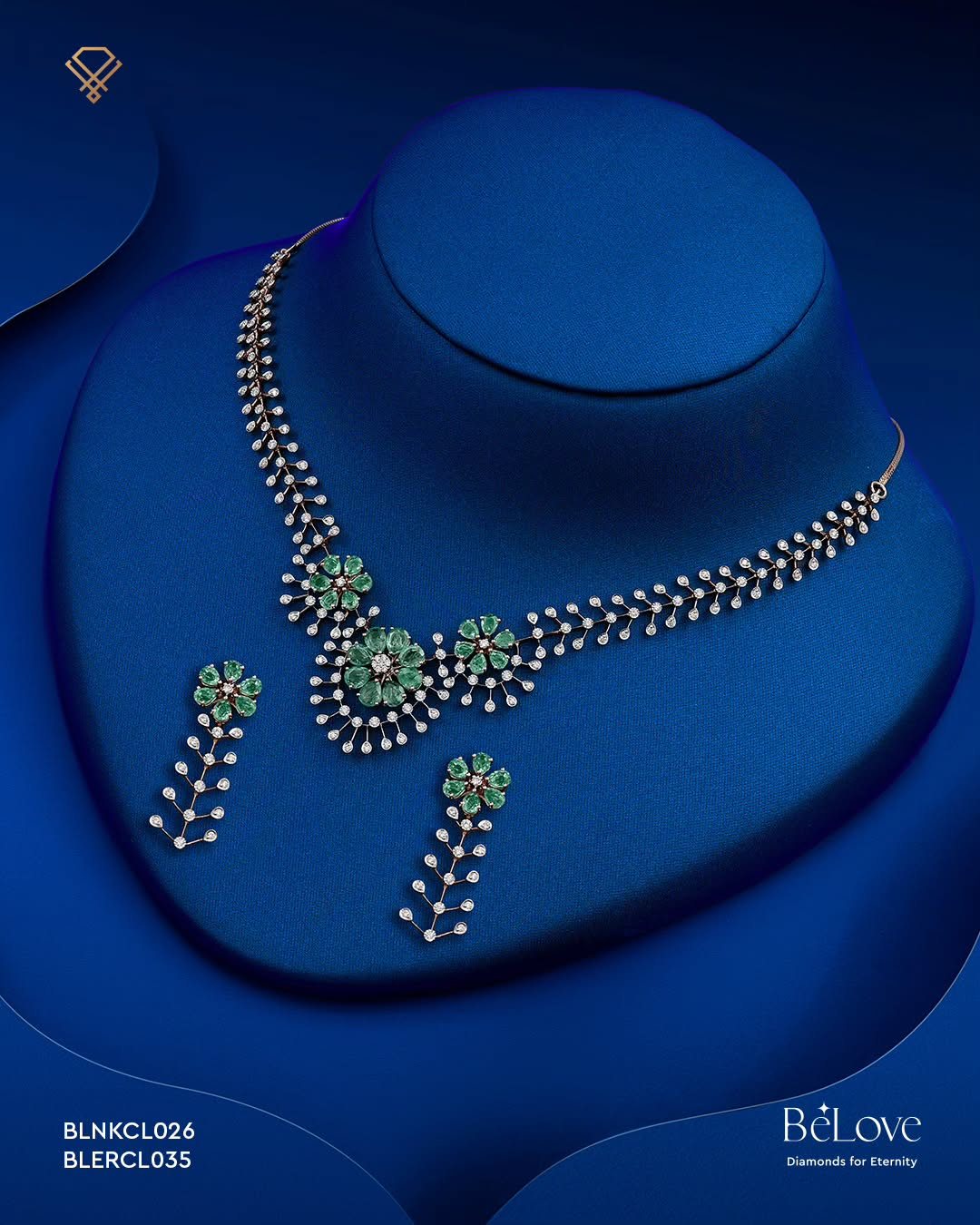 BeLove diamond and emerald necklace on royal-blue paper