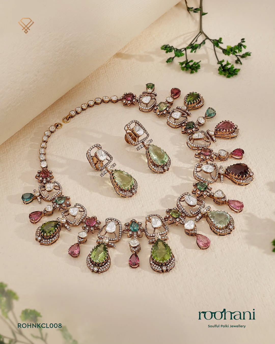 Roohani polki necklace with tourmaline and emerald drops on ivory linen