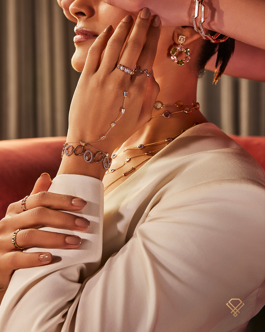 Editorial photograph of a Meralda client wearing layered gemstone jewellery from the Kozhikode boutique