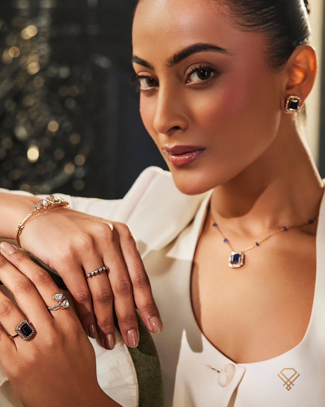A Meralda muse in ivory, wearing a BeLove diamond pendant and ring — the house campaign
